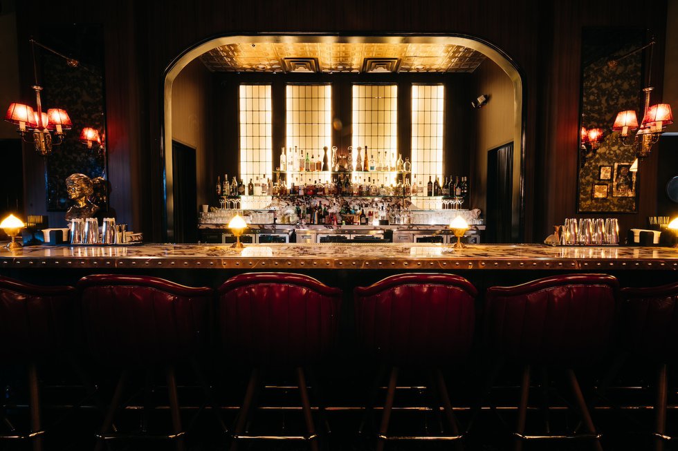 2 - A stunning, purple violet marble-topped custom bar serves as the centerpiece of The Ro.jpg